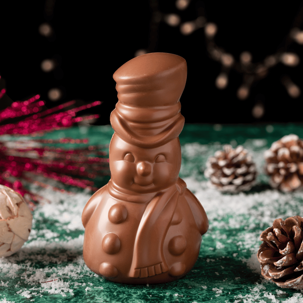 Indulge in the luxurious Aaraya Chocolate Snowman, a festive delight handcrafted with premium French chocolate. Elevate your holiday celebrations with this artisanal masterpiece, a perfect blend of rich flavors and sophistication