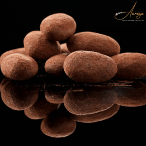 Close-up of Aaraya Chocolates' tempting Chocolate Coated Almonds, showcasing the perfect blend of premium nuts and luscious chocolate.