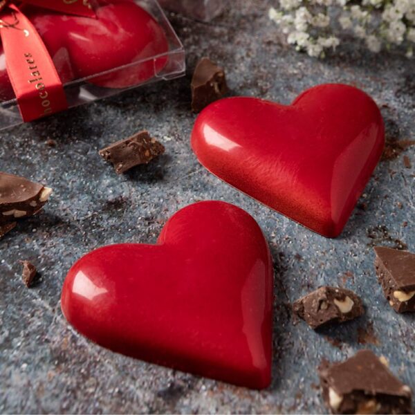 Aaraya Chocolates presents "Twin Hearts": Two red chocolate hearts, a lavish Valentine's Day gift of pure indulgence and passion.