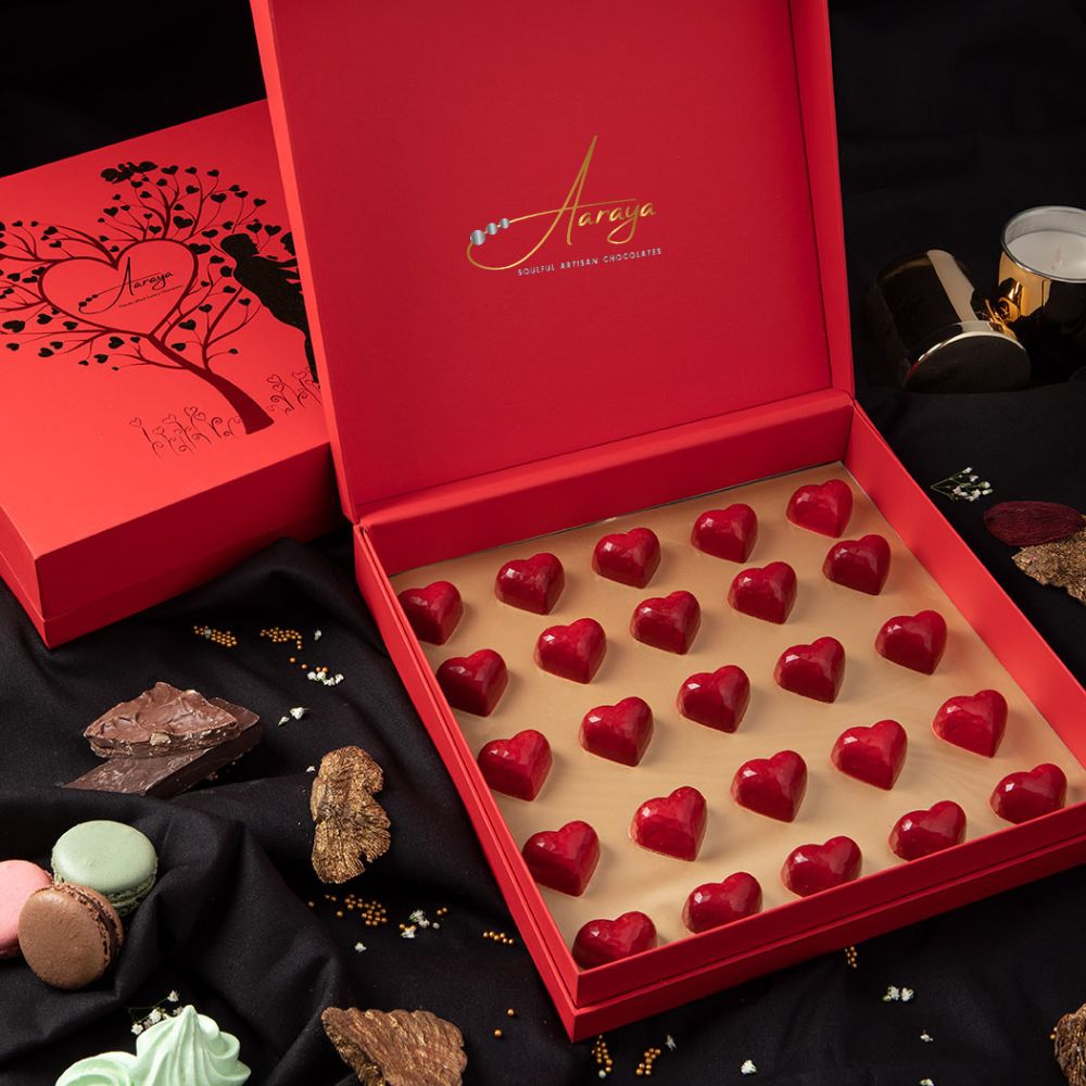 Indulge in Aaraya Chocolates' "Valentines" box—a collection of 25 heart-shaped, red chocolates, a luxurious expression of love.