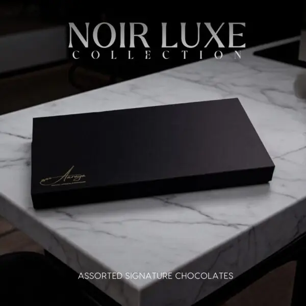 Discover the AARAYA® Assorted Chocolates Box - Noir Luxe Collection, a luxurious selection of handcrafted chocolates in an elegant black satin box. Perfect for gifting or indulging in premium chocolate bliss.