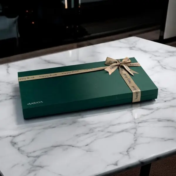 AARAYA® Nuts Chocolates Box - Emerald Luxe Collection in a luxurious green satin box, featuring premium handcrafted chocolates for gifting or indulgence