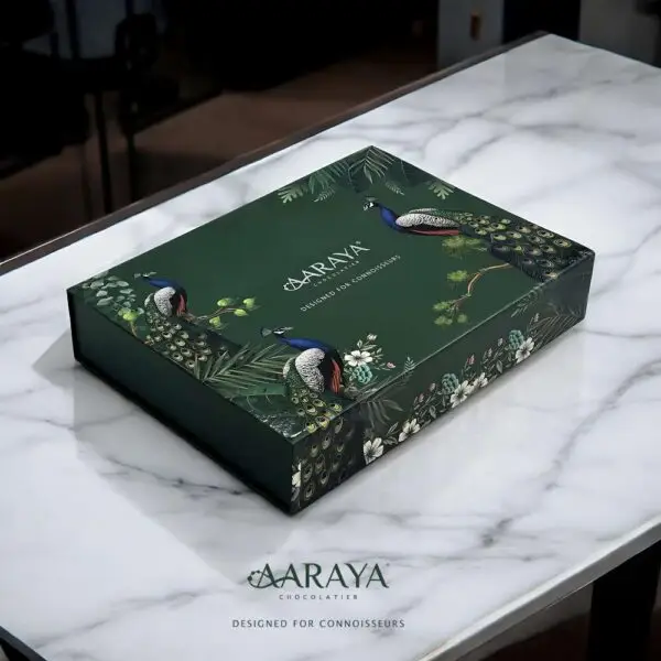 AARAYA® Regal Collection - Luxurious emerald green box with 104 handcrafted chocolates, featuring 52 AARAYA® Signature Collection pieces and 52 premium-filled wrapped chocolates. Perfect for festive gifting, weddings, and corporate presents.