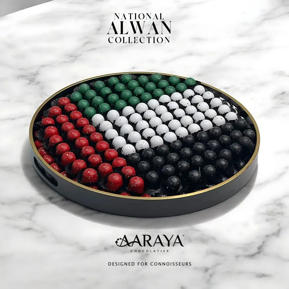 Vibrant NATIONAL DAY ALWAN Collection by AARAYA® Chocolatier for UAE National Day, featuring 172 handcrafted premium chocolates in a colorful 45 cm display, celebrating unity, pride, and tradition. Total weight of 4.1 kg, including 2.4 kg of artisanal chocolates. Available for AED 749.