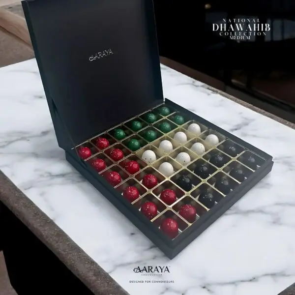 Luxurious DHAWAHIB Collection by AARAYA® Chocolatier for UAE National Day, featuring handcrafted premium chocolates elegantly arranged in beautifully designed boxes, celebrating tradition, unity, and pride