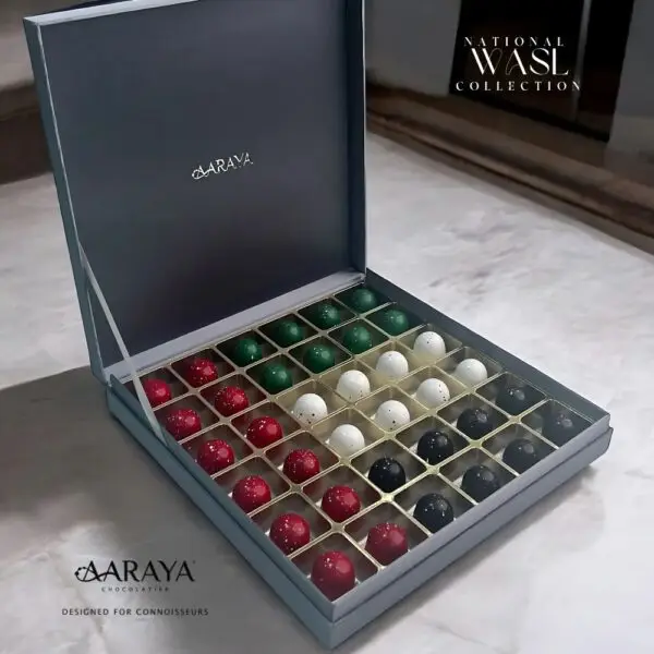 Luxurious WASL Collection by AARAYA® Chocolatier for UAE National Day, featuring an elegant assortment of handcrafted premium chocolates in various sizes and packaging. Celebrating unity, tradition, and pride with a range of boxes, including LUXE, NATIONAL, and PREMIUM editions, each box is crafted with the finest ingredients for a sophisticated chocolate experience