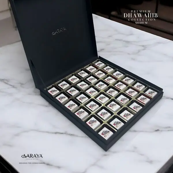 Luxurious DHAWAHIB Collection by AARAYA® Chocolatier for UAE National Day, featuring handcrafted premium chocolates elegantly arranged in beautifully designed boxes, celebrating tradition, unity, and pride