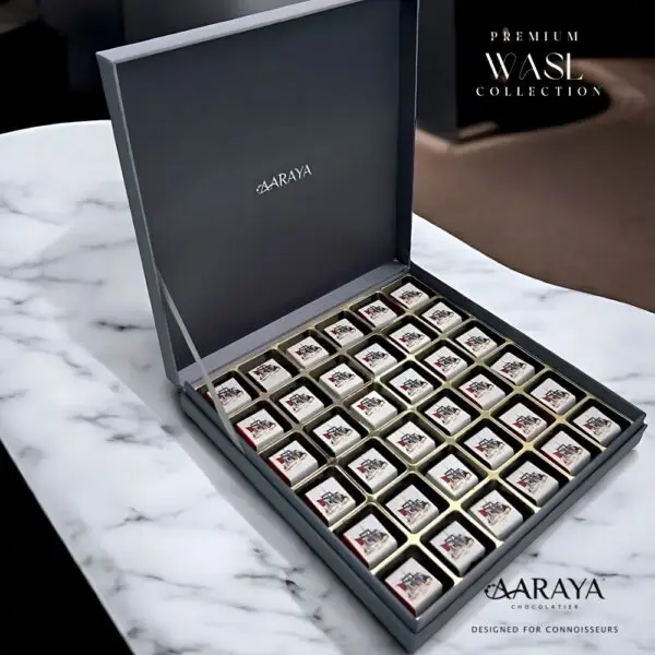 Luxurious WASL Collection by AARAYA® Chocolatier for UAE National Day, featuring an elegant assortment of handcrafted premium chocolates in various sizes and packaging. Celebrating unity, tradition, and pride with a range of boxes, including LUXE, NATIONAL, and PREMIUM editions, each box is crafted with the finest ingredients for a sophisticated chocolate experience