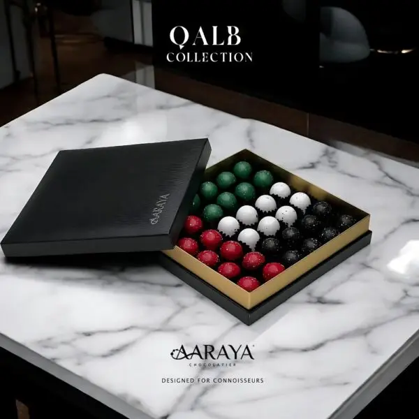 Luxurious QALB Collection by AARAYA® Chocolatier for UAE National Day, symbolizing the heart of unity, tradition, and pride. Featuring 36 handcrafted premium chocolates in an elegant 20 cm x 20 cm box, with a total weight of 700 grams, including 500 grams of artisanal chocolates. Celebrating heritage and luxury. Available for AED 399