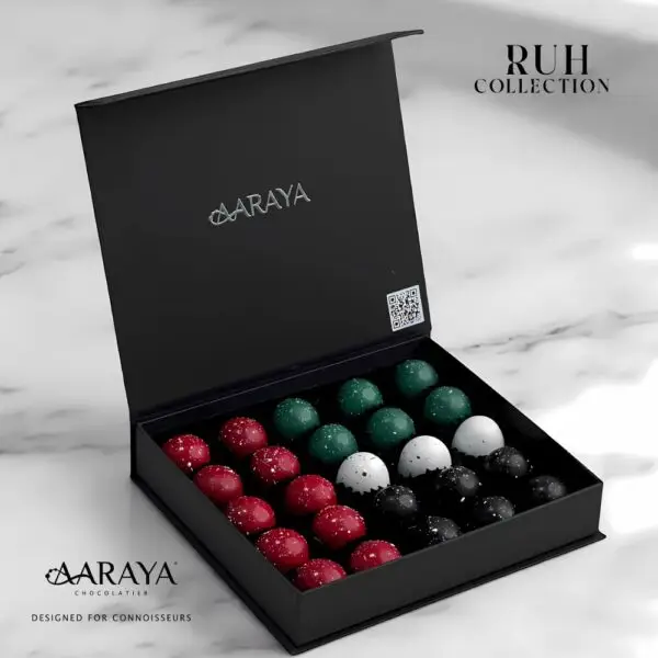 Luxurious RUH Collection by AARAYA® Chocolatier for UAE National Day, symbolizing the spirit of unity, pride, and tradition. Featuring 25 handcrafted premium chocolates in an elegant 18 cm x 16 cm box, with a total weight of 480 grams, including 350 grams of artisanal chocolates. Celebrating heritage and luxury. Available for AED 199.