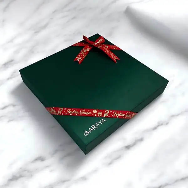 Emerald Luxe Festive Luxury Chocolates Box by AARAYA® featuring 36 handcrafted premium chocolates in an elegant emerald-inspired limited-edition packaging, perfect for Christmas gifting and celebrations.