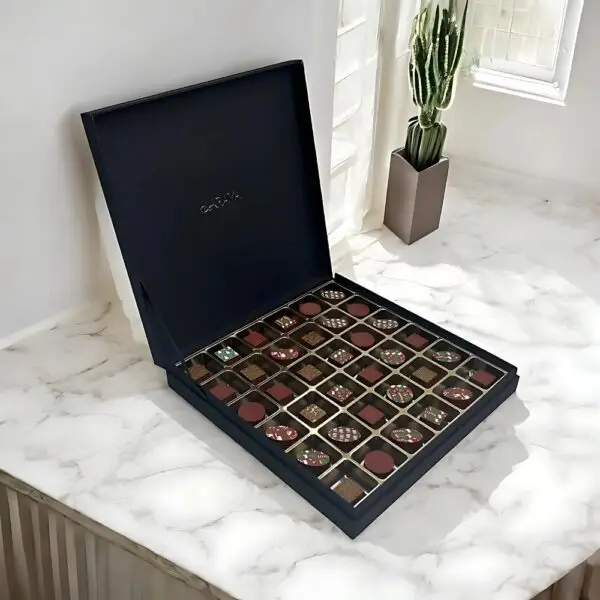 AARAYA® Noir Luxe Festive Luxury Chocolates Box featuring 36 handcrafted premium chocolates in an elegant limited-edition packaging, perfect for Christmas gifting.