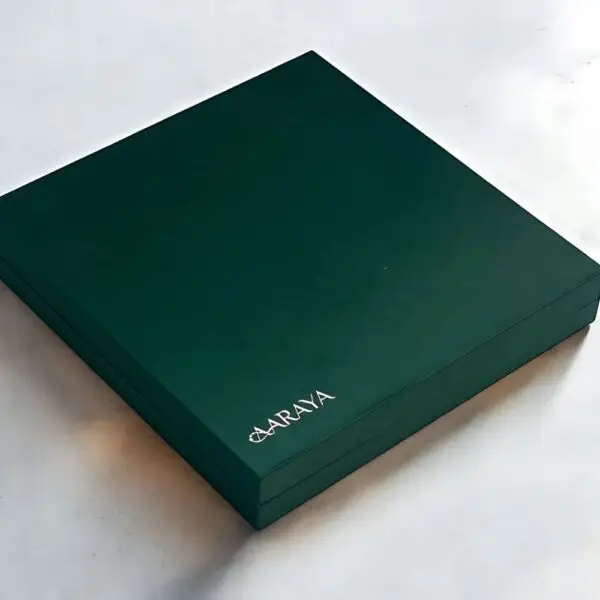 AARAYA® Emerald Luxe Assorted Dates Gift Box - Medium showcasing an elegant emerald-green box filled with premium gourmet dates and indulgent fillings like pistachio ganache, salted hazelnut, and orange peel.