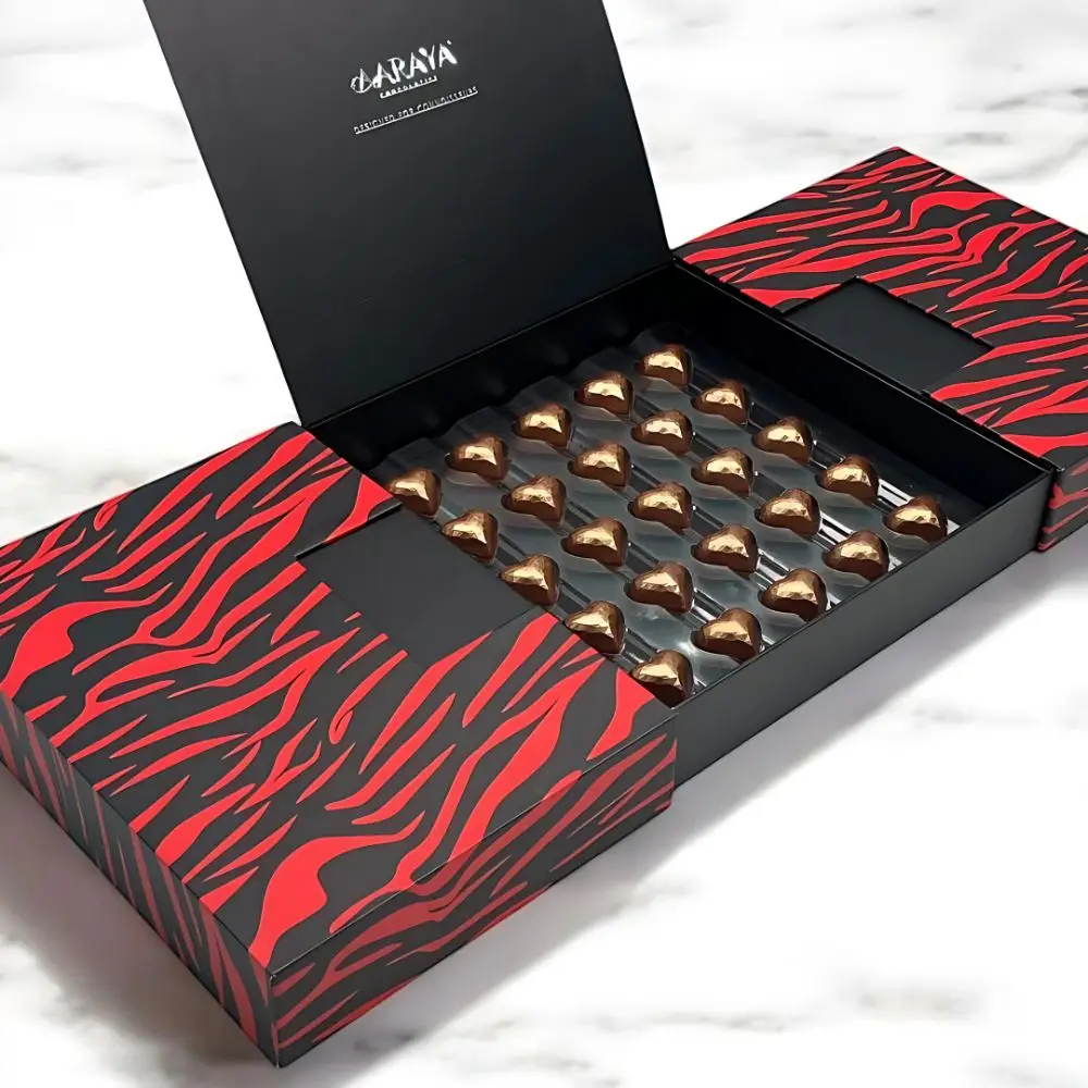 Valentine’s Day Signature Chocolate Love Box by AARAYA® featuring 40 golden heart-shaped chocolates in a luxurious black and red patterned design.