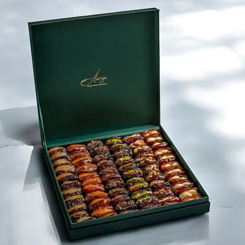 AARAYA® Emerald Luxe Assorted Dates Gift Box - Medium showcasing an elegant emerald-green box filled with premium gourmet dates and indulgent fillings like pistachio ganache, salted hazelnut, and orange peel.