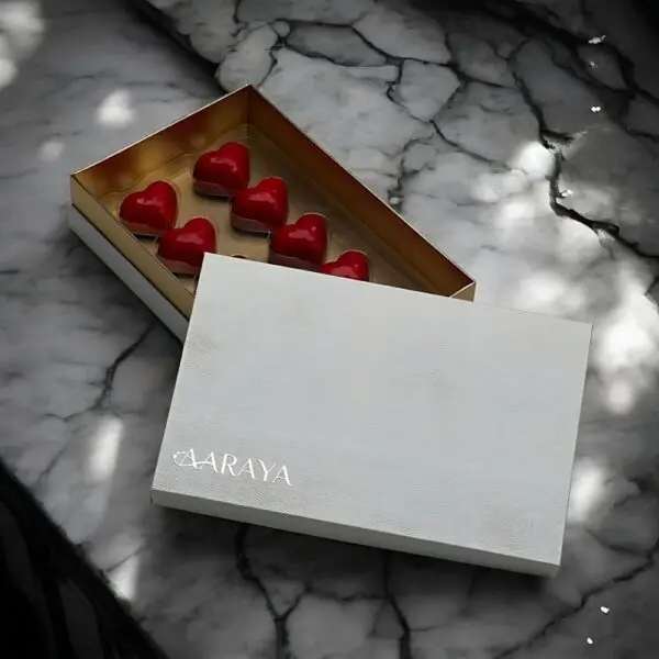 Pearl Valentines Love Box by AARAYA®, featuring 10 heart-shaped plain milk chocolates in a sleek pearl white box.