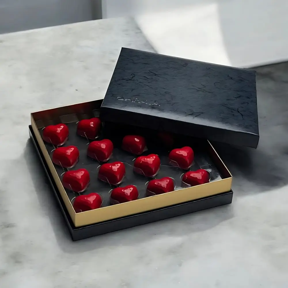 Prestige Noir Valentine's Collection by AARAYA®, featuring 16 premium-filled chocolates in a sleek and luxurious black box.