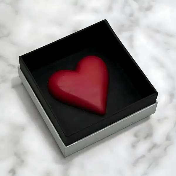 Heart of Queen Valentine's Chocolate Collection by AARAYA®, featuring a handcrafted heart-shaped premium chocolate in a sleek silver and black box.