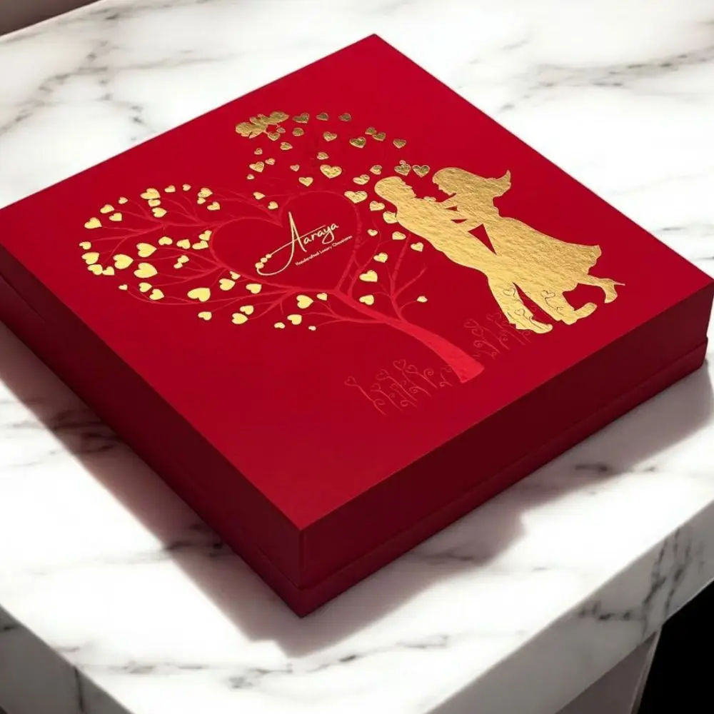 Luxury Valentine’s Day Chocolate Gift Love Box by AARAYA® with 25 premium handcrafted chocolates in an elegant red and gold design.